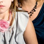 Ainsley, who began showing signs of puberty at age 6, and her mother. Elinor Carucci for The New York Times